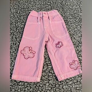 Pink Disney jeans with embroidered butterflies